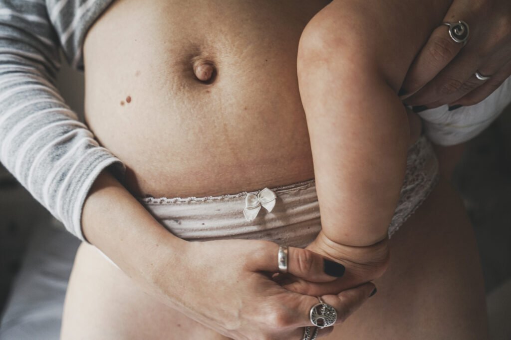 Image of a woman and her baby at postpartum recovery